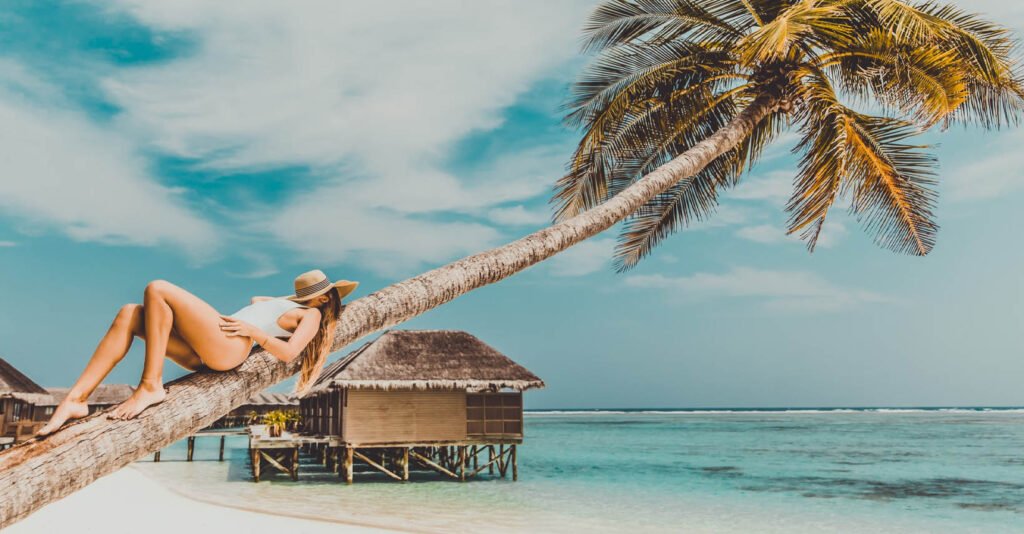 beautiful woman sunbathing on a tropical island beach with the best sun protection