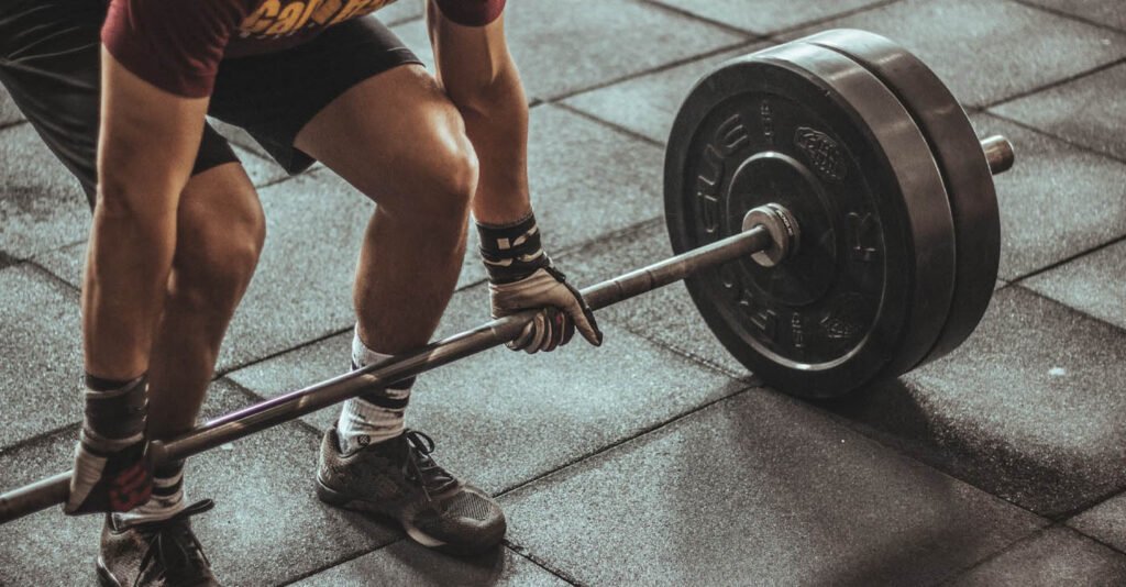 weightlifting doing barbell deadlift in the gym